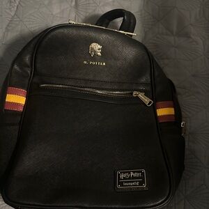 Warner Bros. Black Backpack with Red and Yellow Stripes